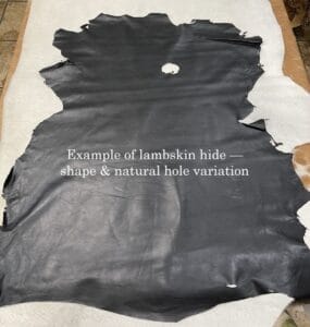 Example of lambskin leather hide with natural hole and irregular shape