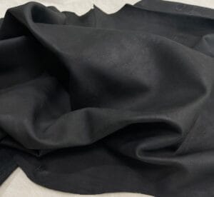 Rugged Lambskin Leather Economy Jet Black with visible grain, scratches, and soft matte finish