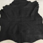 Rugged Lambskin Leather Economy Jet Black with visible grain, scratches, and soft matte finish