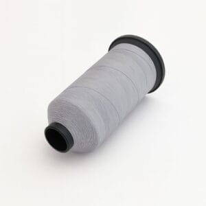Spool of light gray nylon sewing thread on a white background – Avetco