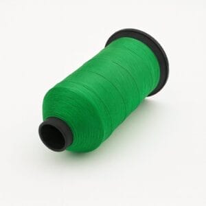 Bright light green nylon thread spool on white background – Avetco B33 B69
