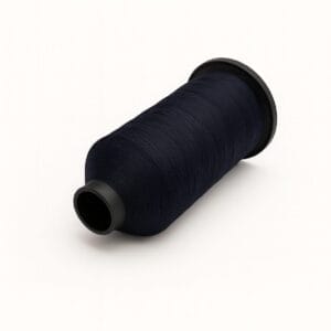 Navy blue nylon bonded sewing thread spool on a white background – Avetco