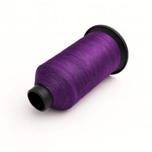 Purple nylon bonded sewing thread spool on a white background – Avetco