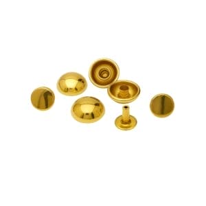 Polished gold dome rivets arranged on a clean white background, showing caps, sockets, and post details with a reflective metallic fi